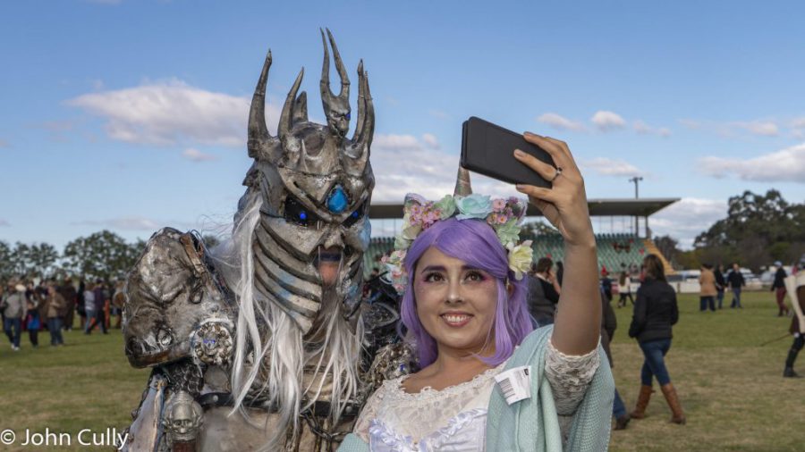 Two people dressed in cosplay take a selfie at Winterfest