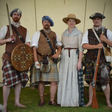 4 Scottish Jacobite reenactors standing together